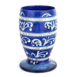 AN UNUSUAL MOORCROFT FOOTED OVOID VASE decorated in shades of blue with the Banded Fern design