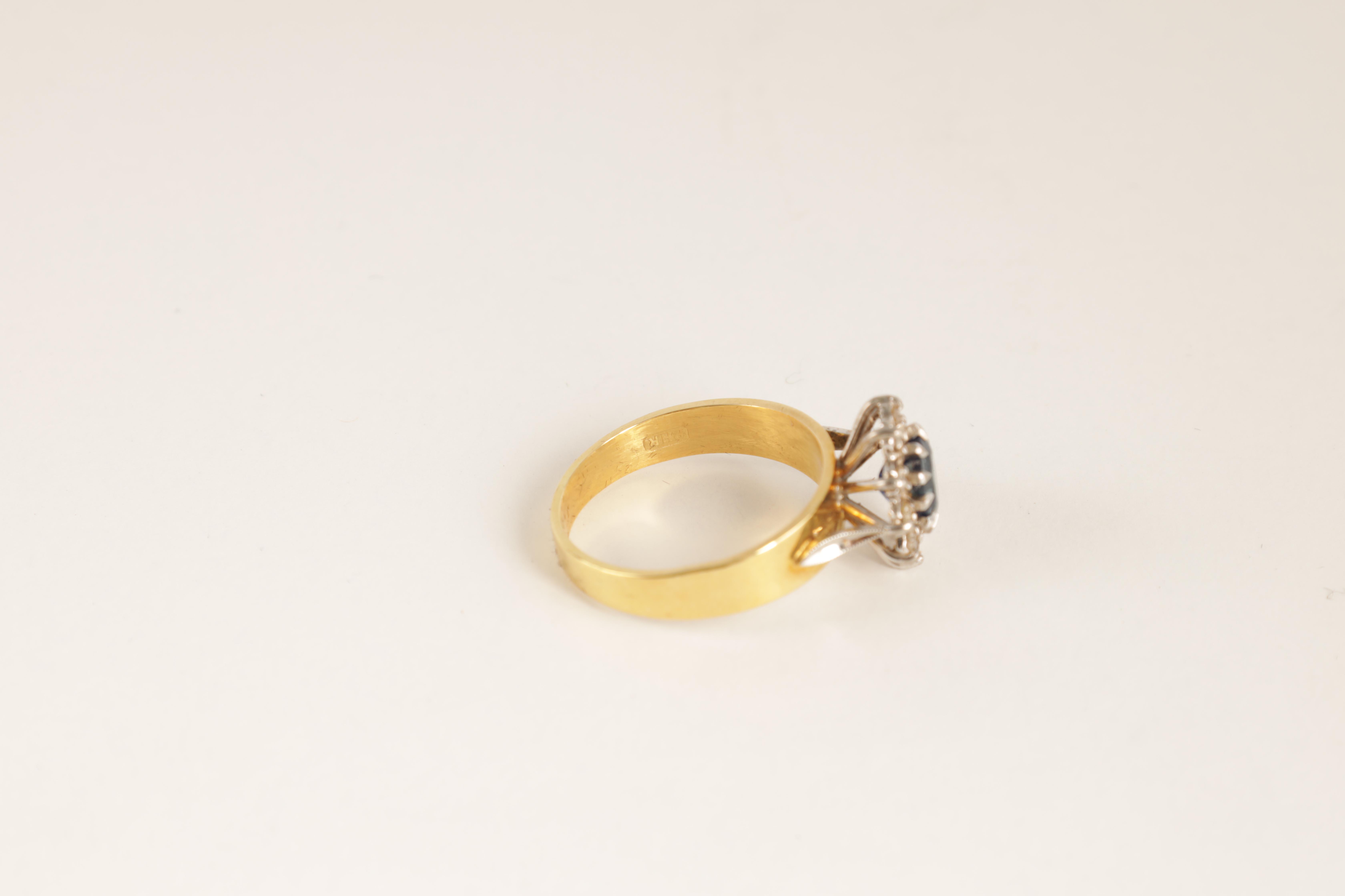 A LADIES 14CT GOLD DIAMOND AND SAPPHIRE RING with oval cut centre stone enclosed by 10 brilliant-cut - Image 4 of 6