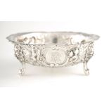 A LATE 19TH CENTURY SILVER EMBOSSED SUGAR BOWL with a beaded rim and foliate decoration on three