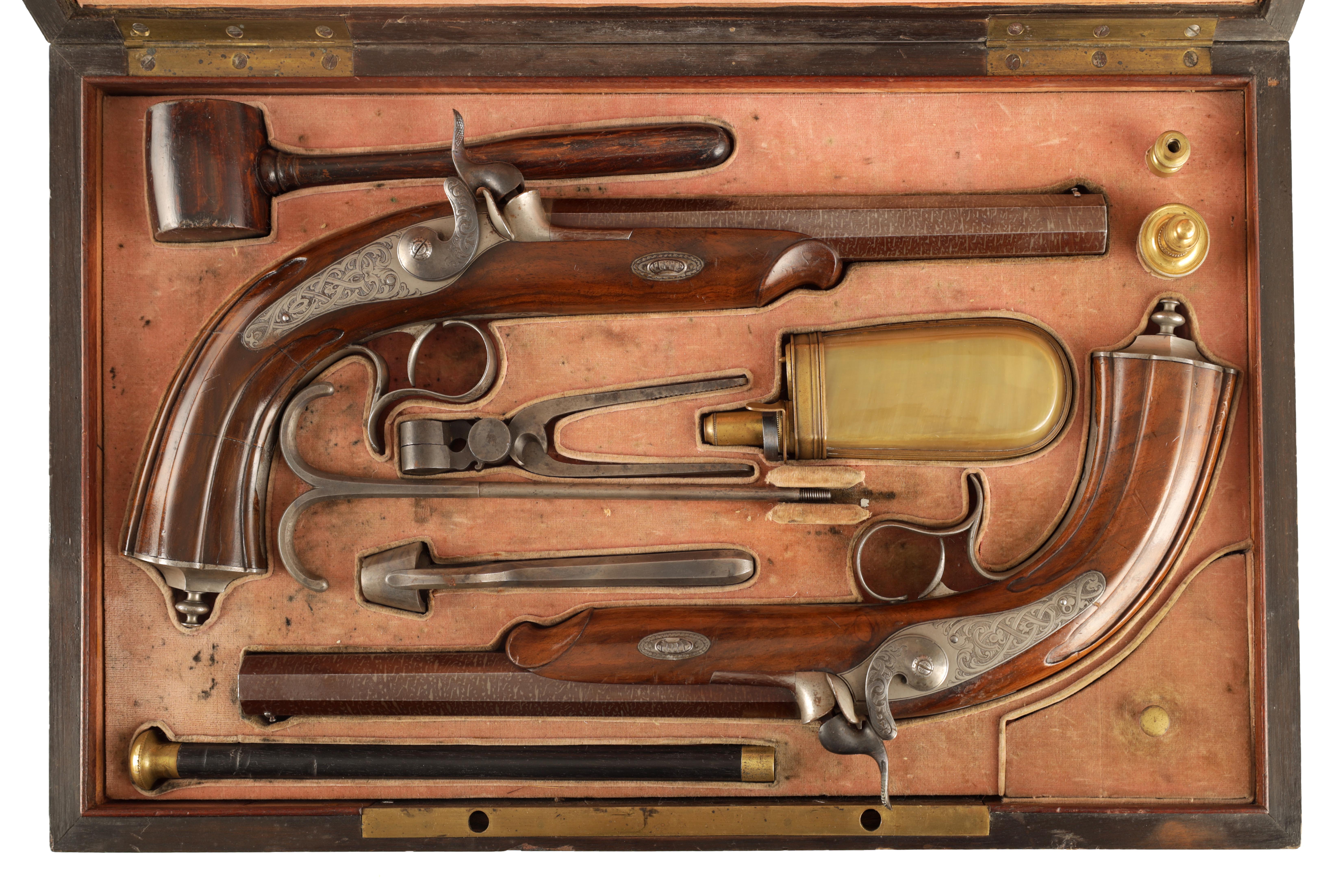 A CASED PAIR OF MID 19TH CENTURY CONTINENTAL PERCUSSION TARGET PISTOLS the damask octagonal