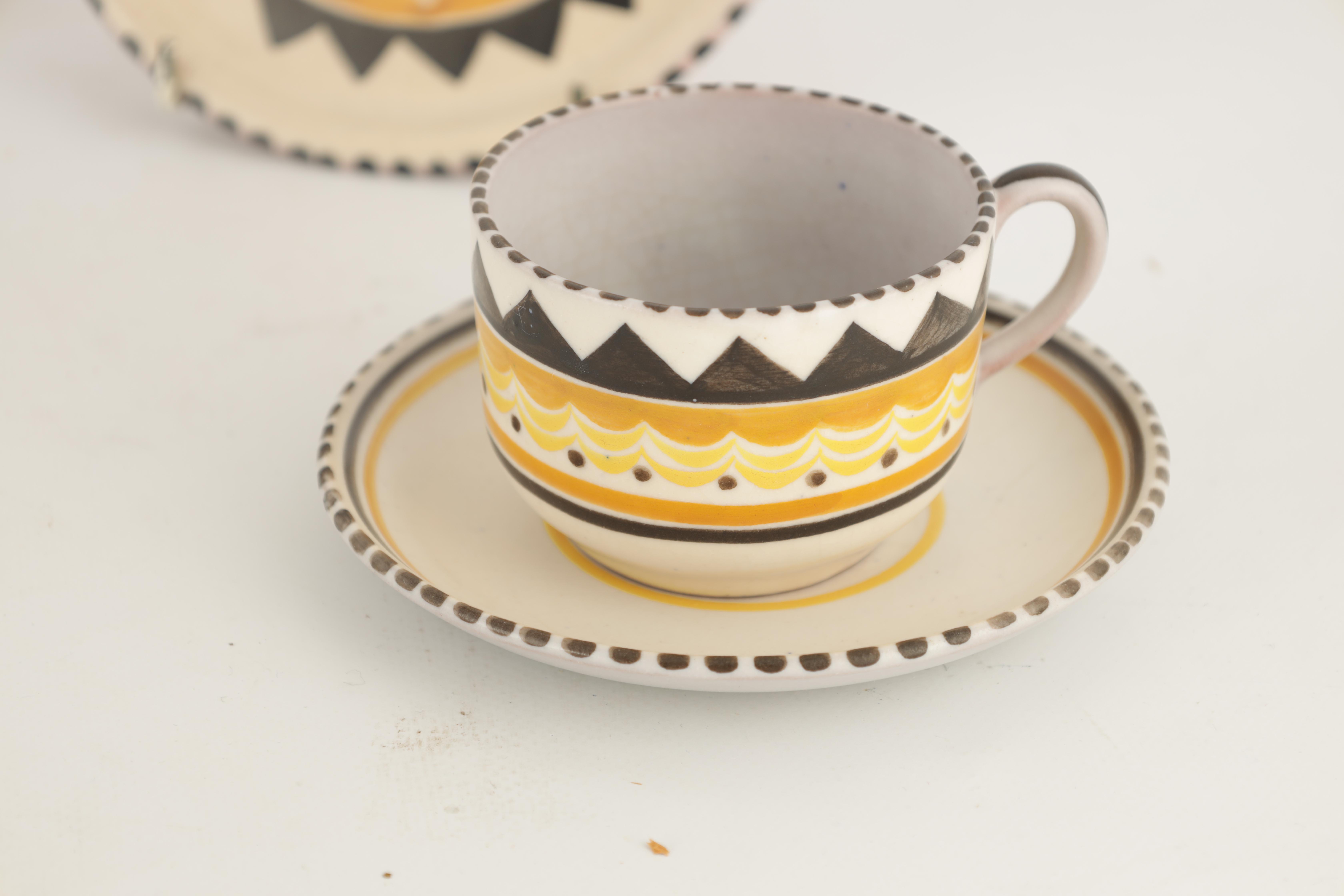 A COLLECTION OF POOLE GEOMETRIC PATTERN TEAWARE including cups, saucers and three teapot stands - Image 3 of 8