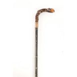 A 19TH CENTURY SWORD STICK with ebonised faux bamboo shaft and root wood handle having gilt wood