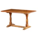 A WILF HUTCHINSON (SQUIRELLMAN) OAK REFECTORY TYPE DINING TABLE with adzed top above hexagonal-