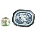AN 18TH CENTURY CHINESE NANKIN BLUE AND WHITE DISH with pagoda and landscape decoration 28cm wide