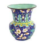 AN EARLY 19TH CENTURY CHINESE ENAMEL VASE of bulbous form with brightly coloured enamel decoration