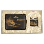 A JAPANESE MEIJI PERIOD JAPANESE DAMASCENE KOMAI CIGARETTE CASE AND LIGHTER inlaid with silver and