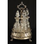 AN EARLY VICTORIAN SILVER 5 BOTTLE CRUET FRAME with shaped pierced handle, turned stem with