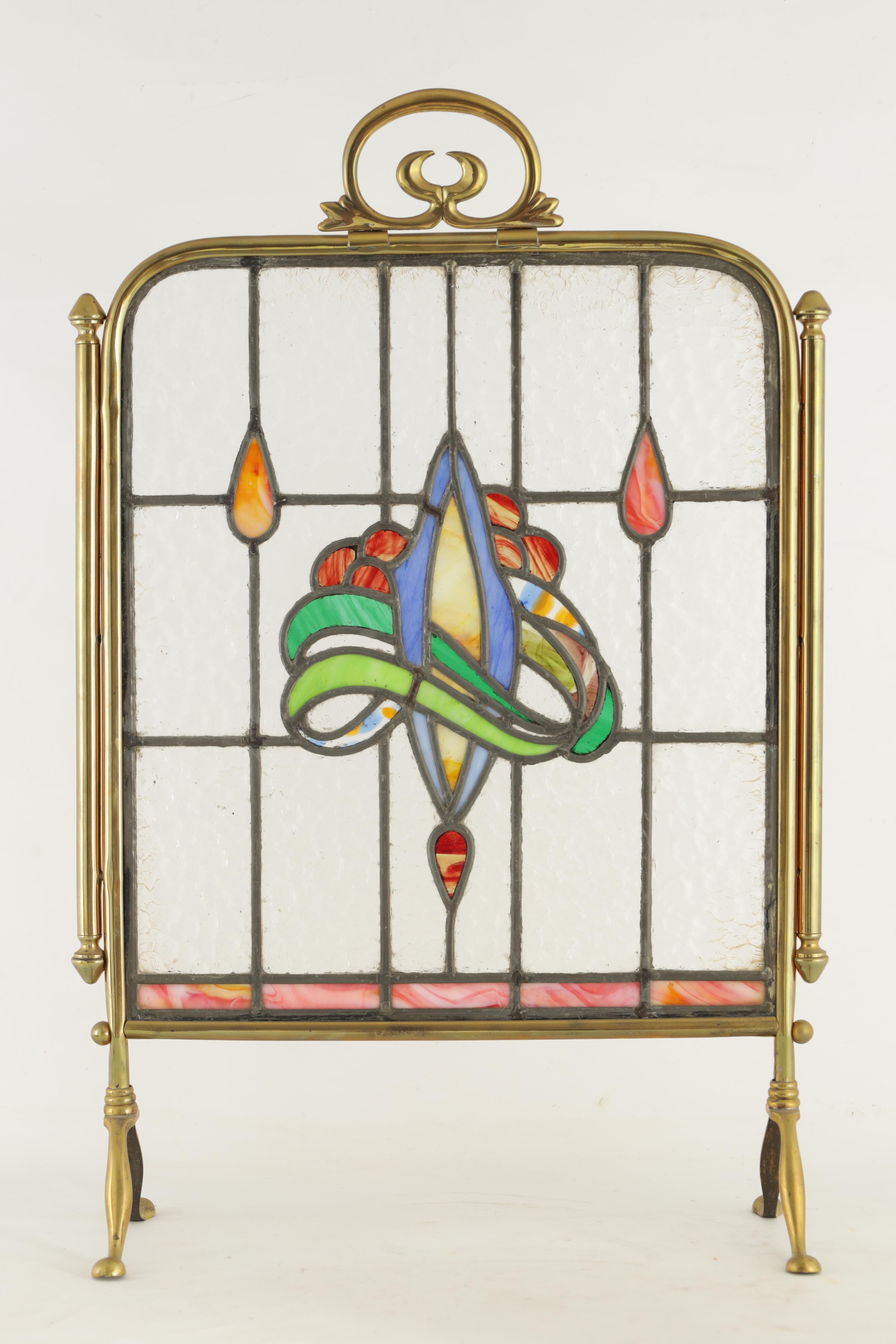 AN ART NOUVEAU BRASS AND STAINED GLASS FIRE SCREEN with coloured leafwork centre surrounded by a - Image 2 of 5