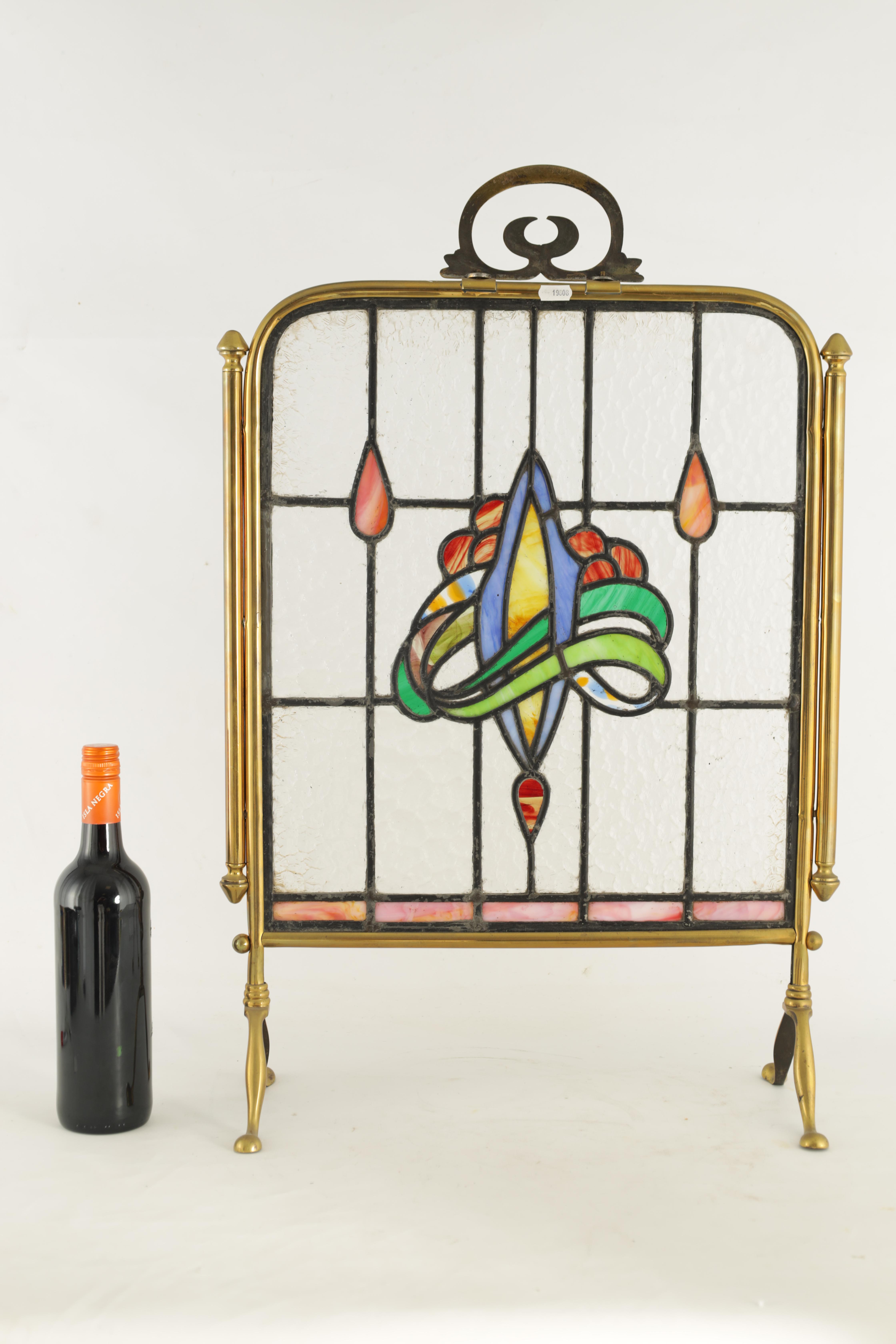 AN ART NOUVEAU BRASS AND STAINED GLASS FIRE SCREEN with coloured leafwork centre surrounded by a - Image 5 of 5
