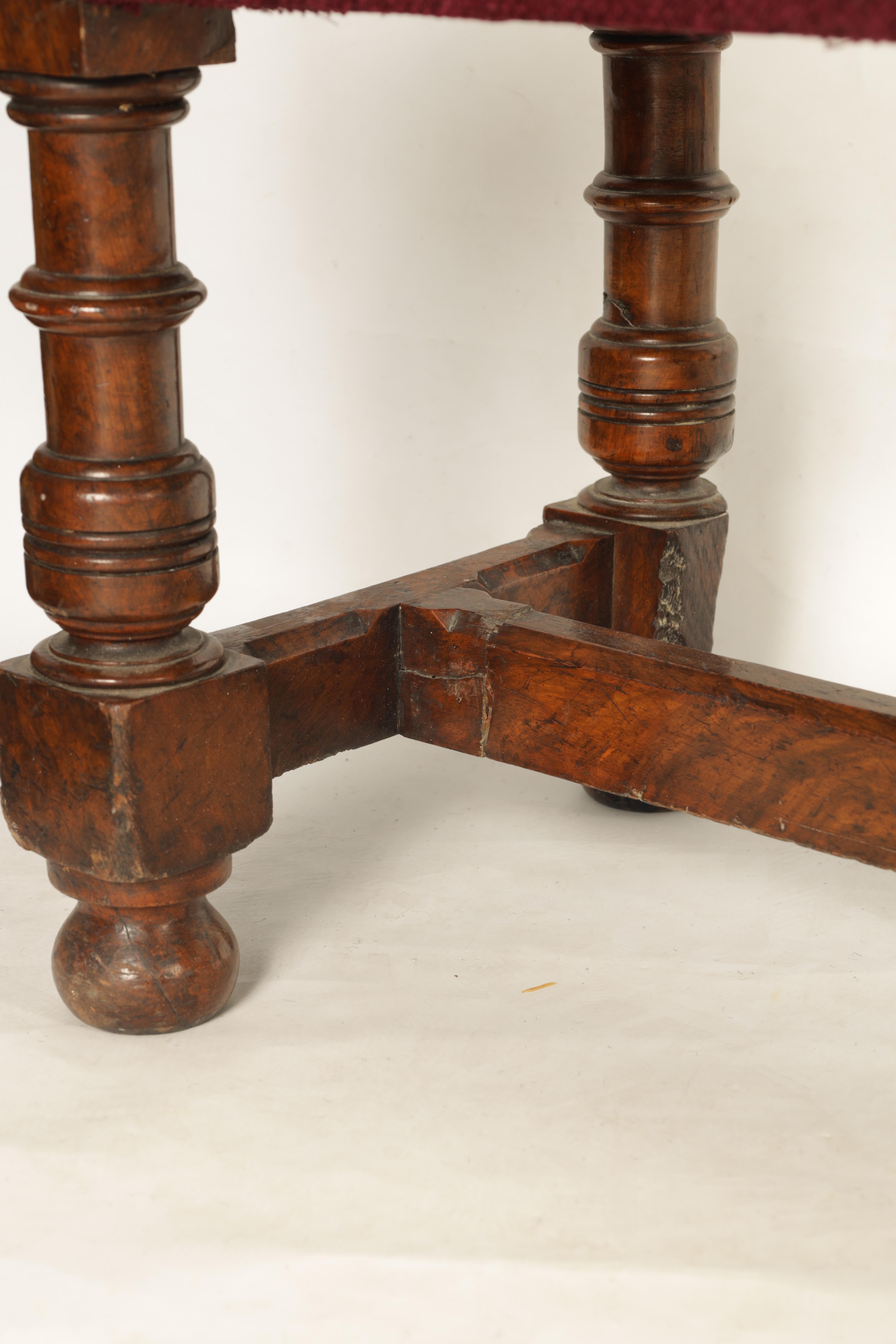 A 19TH CENTURY WALNUT WINDOW SEAT with upholstered top; standing on ring turned legs joined by a H - Image 6 of 7