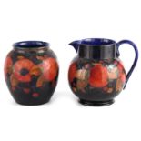 A 1930S/40S MOORCROFT LARGE BULBOUS JUG tube lined and decorated in the Pomegranate pattern on a