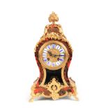A LATE 19TH CENTURY FRENCH BOULLE WORK BRASS AND TORTOISESHELL INLAID MANTLE CLOCK the waisted