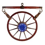 A 19TH CENTURY PAINTED WOOD NOVELTY WALL CLOCK FORMED AS A WAGON WHEEL AND SPRING with blue