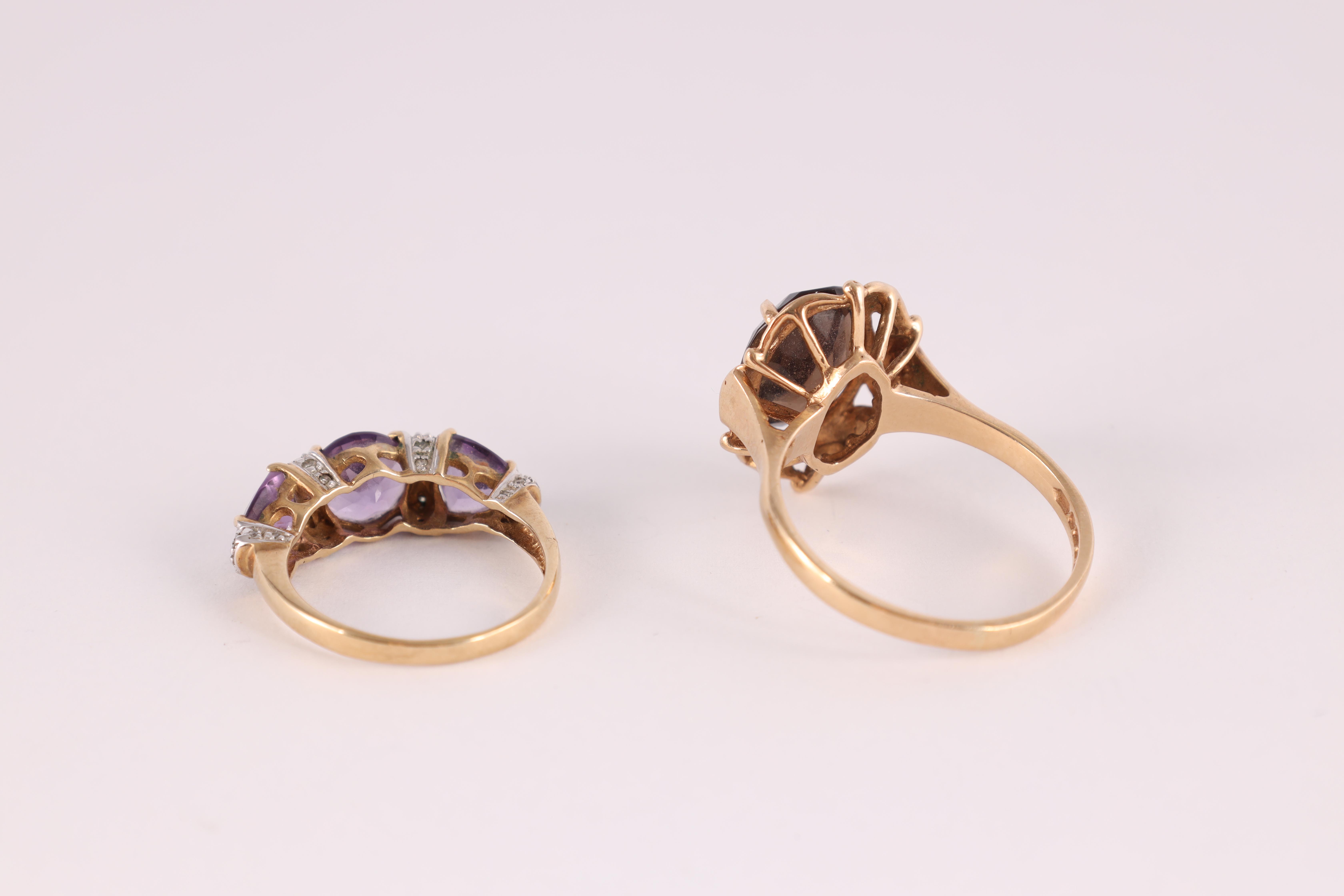 A LADIES 9CT GOLD SMOKEY QUARTZ SOLITAIRE RING the large stone measuring 10mm wide and 12mm, app. - Image 2 of 6