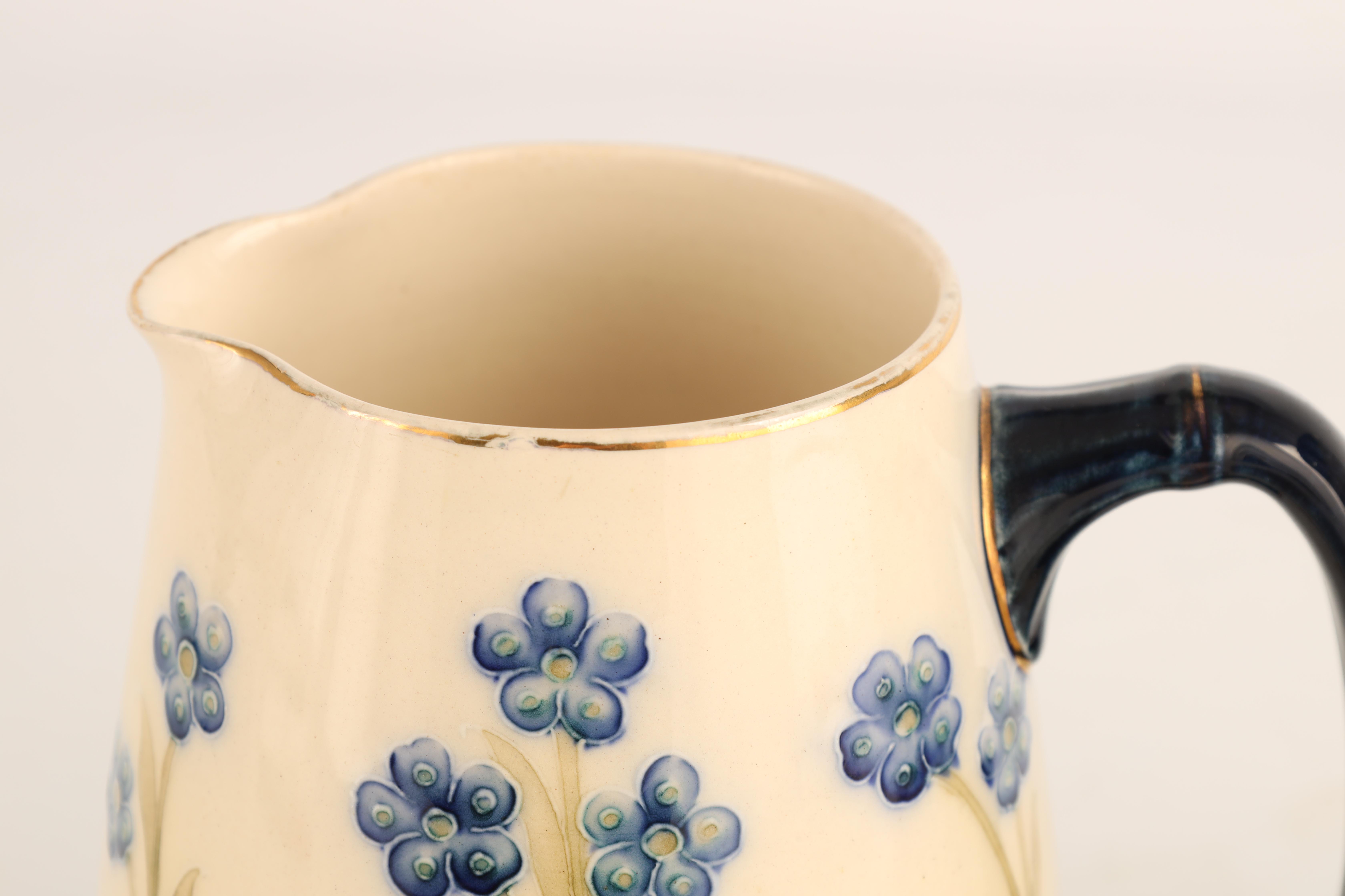 A JAMES MACINTYRE AND CO BURSLEM BULBOUS JUG tube lined and decorated in the blue poppy pattern - Image 6 of 9