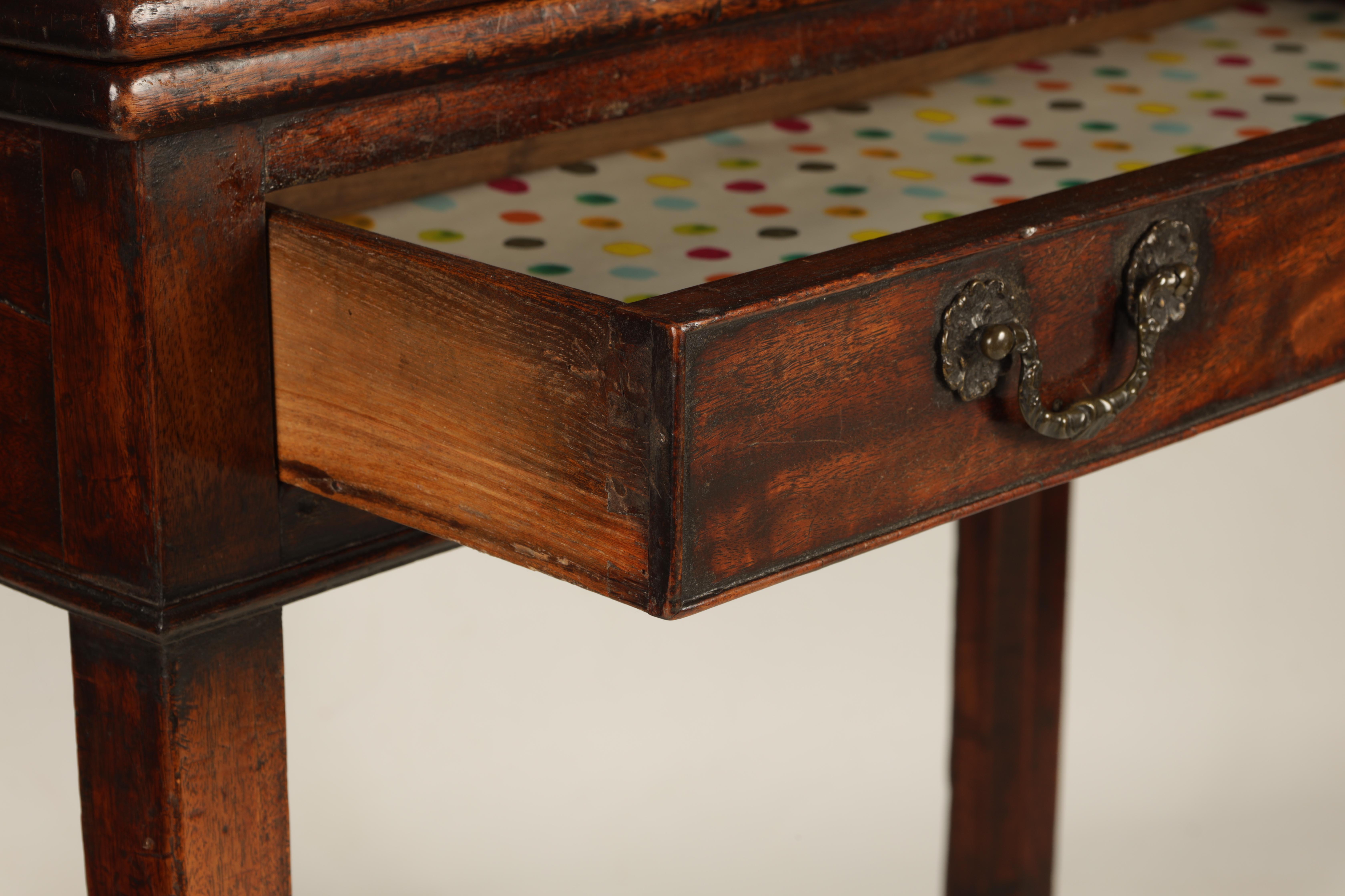 A GEORGE III MAHOGANY TEA TABLE with fold over top above a frieze drawer; standing on square - Image 2 of 6