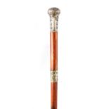 A LATE 19TH CENTURY SILVER TOPPED SWORD STICK with faceted silver pommel and scrollwork decoration