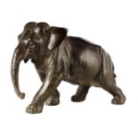A MEIJI PERIOD JAPANESE BRONZE SCULPTURE OF A WALKING ELEPHANT signed with character marks beneath