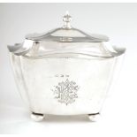 A LATE 19TH CENTURY GEORGIAN STYLE SILVER TEA CADDY of bow-shaped design with moulded corners and