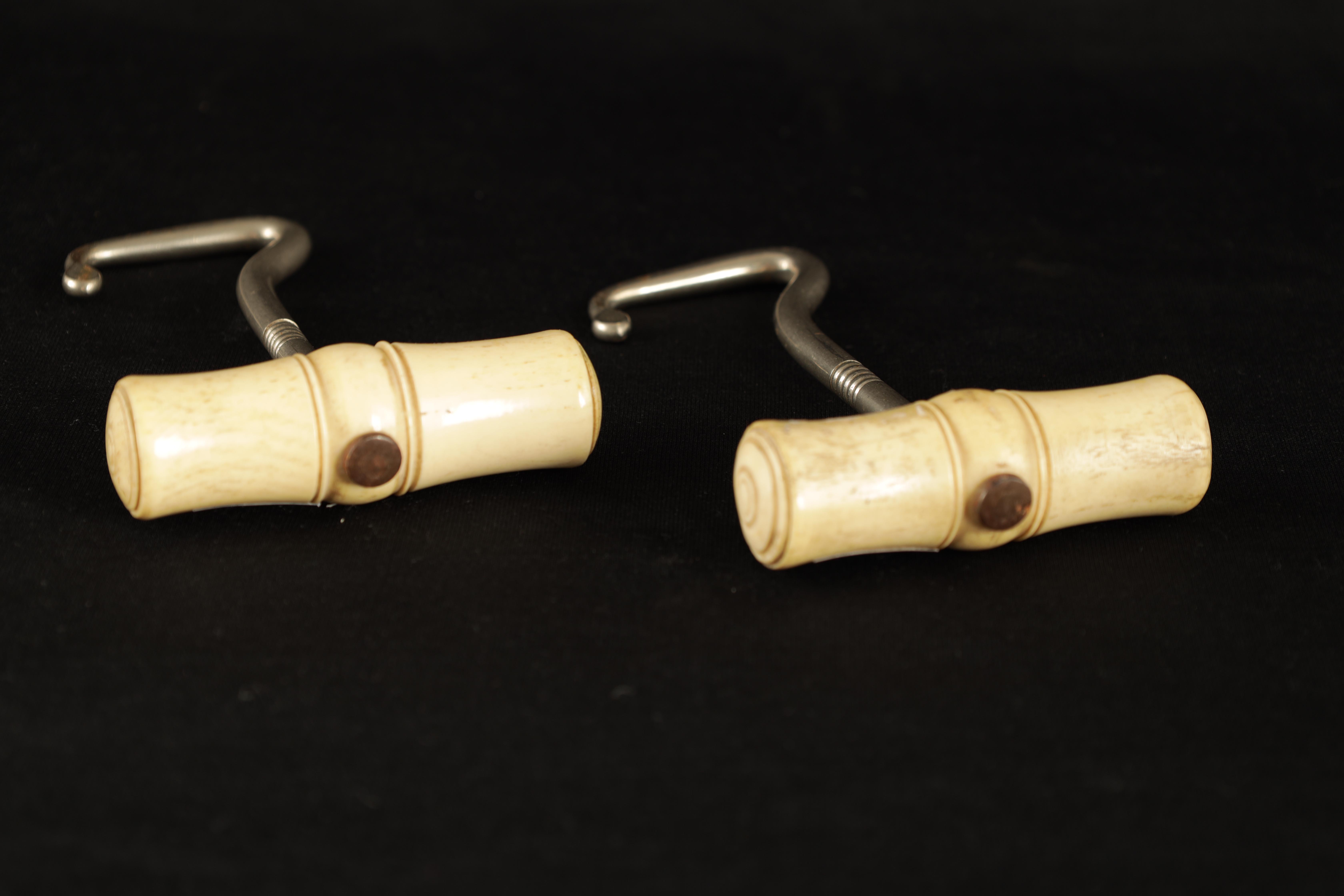 A PAIR OF LATE 19TH CENTURY BONE AND SILVERED METAL BOOTJACKS with turned handles 12.5cm overall - Image 3 of 3