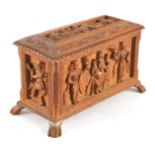 AN EARLY 20TH CENTURY ANGLO-INDIAN CARVED SANDALWOOD BOX with relief carved panels of various Indian