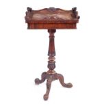 A LATE REGENCY ROSEWOOD PLANT STAND/ OCCASIONAL TABLE IN THE MANNER OF GILLOWS with shaped carved