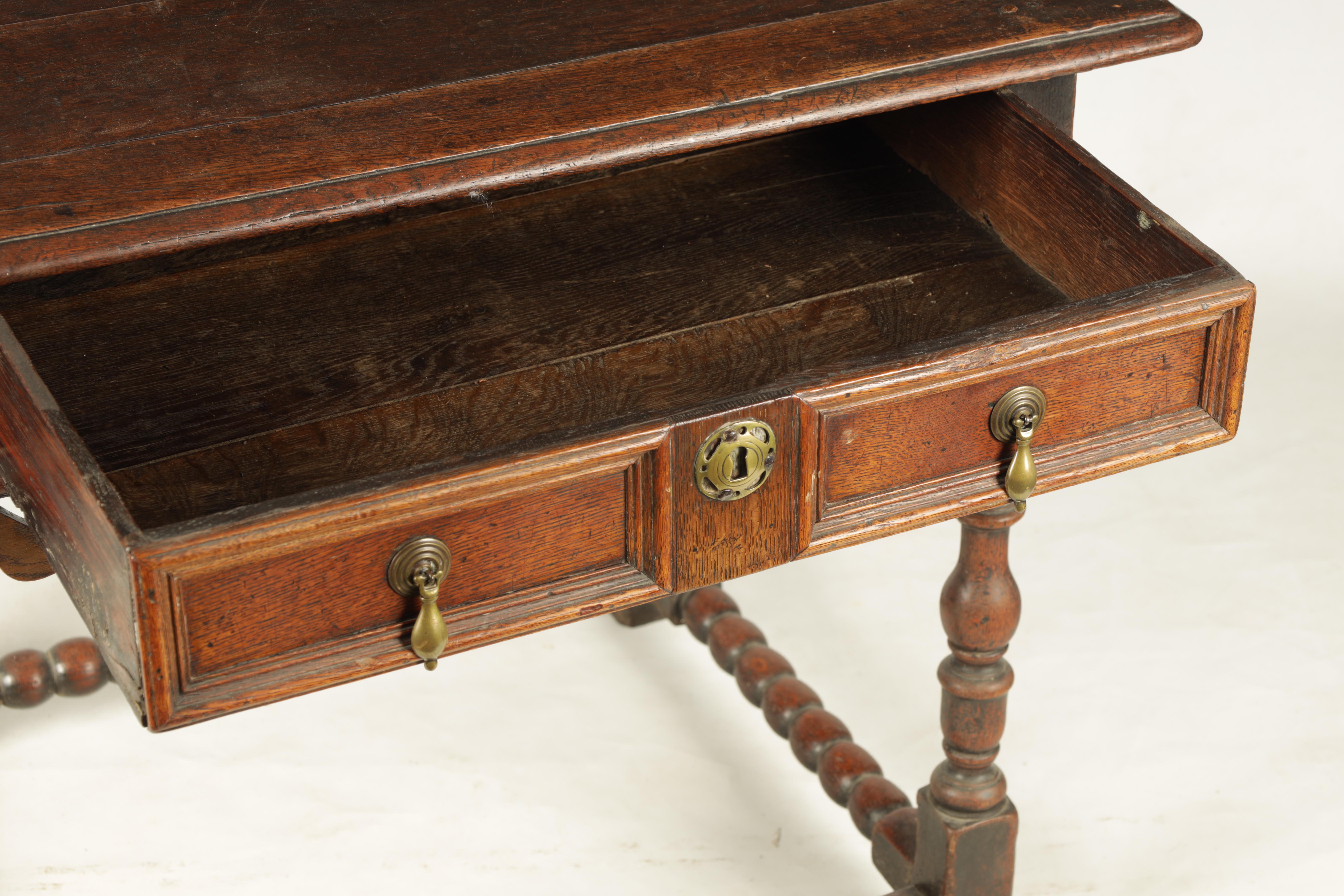 A 17TH CENTURY JOINED OAK SIDE TABLE with panelled frieze drawer and shaped pierced corner blocks; - Image 4 of 8