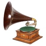 AN EARLY 20TH CENTURY OAK CASED HMV MONARCH SENIOR GRAMOPHONE WITH ORIGINAL WOODEN HORN the carved