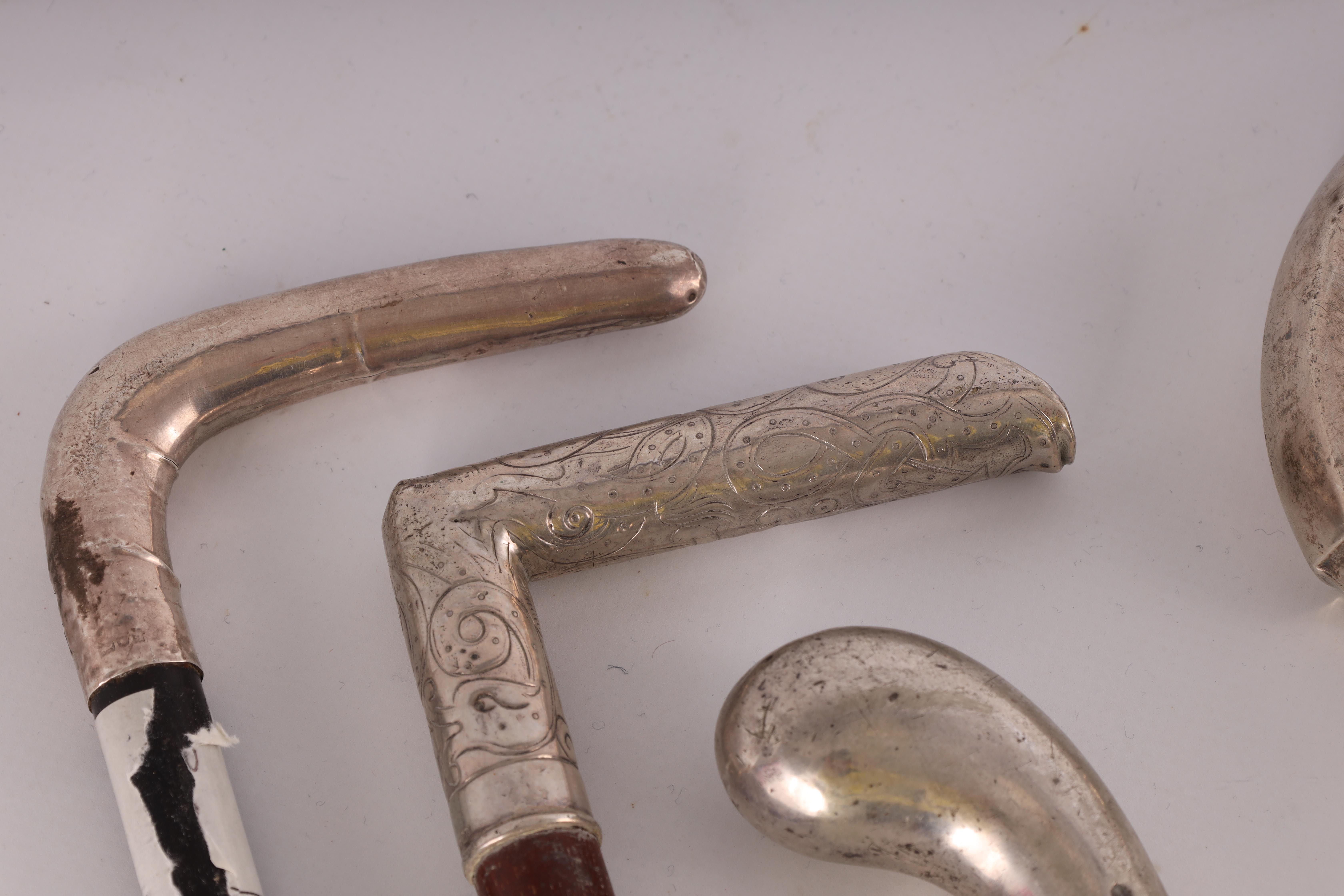 A COLLECTION OF FIVE SILVER TOPPED WALKING STICKS AND A SWAGGER STICK of various designs with - Image 2 of 7