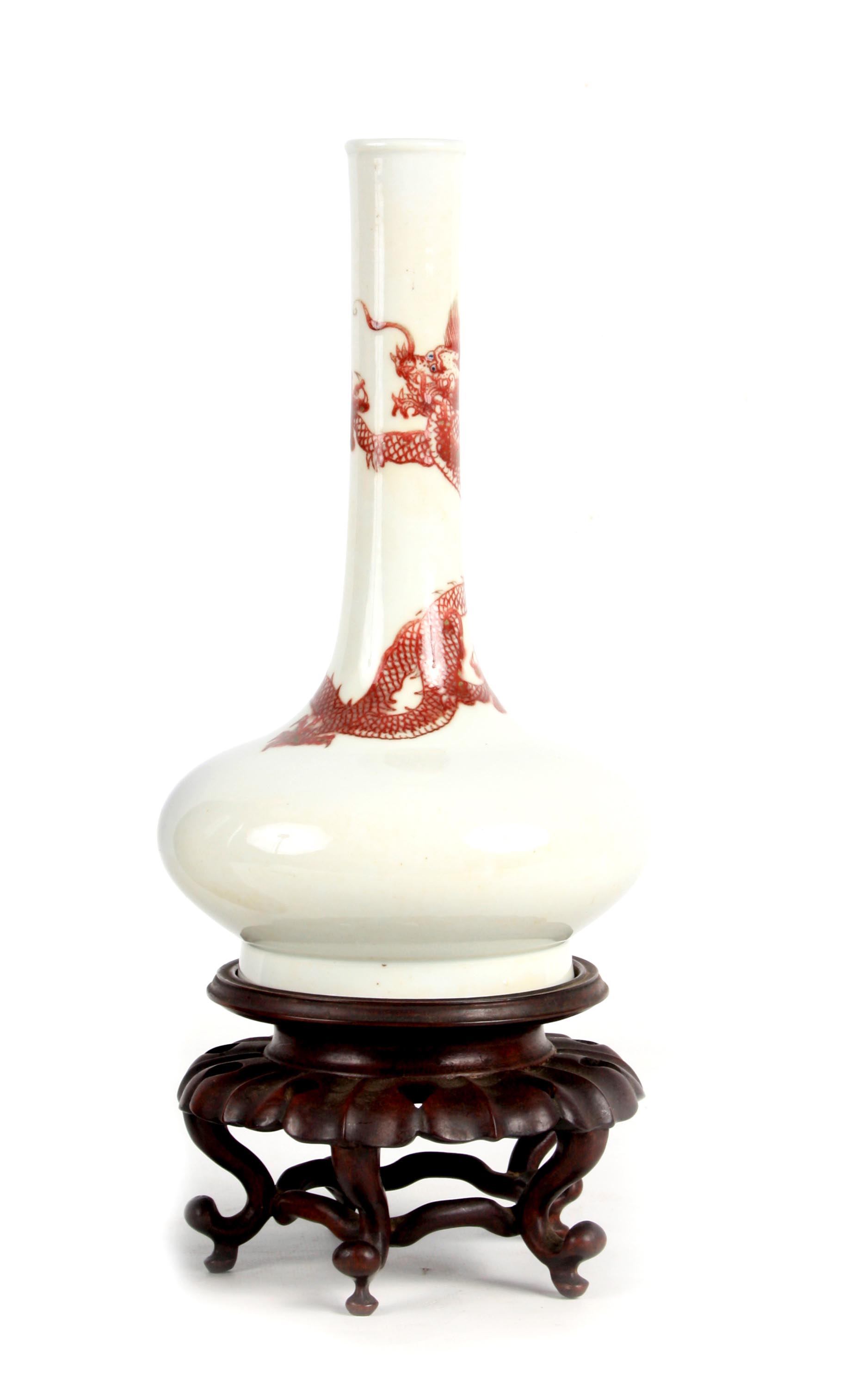 A 19TH CENTURY CHINESE UNDERGLAZE RED DRAGON VASE of bottle shape decorated with a five claw