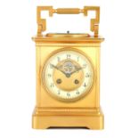 A LARGE FRENCH GILT BRASS CARRIAGE CLOCK WITH BAROMETER the moulded case with hinged handle, the top