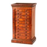 A 19TH CENTURY BURR WALNUT MINIATURE WELLINGTON CHEST having stepped moulded top above a bank of