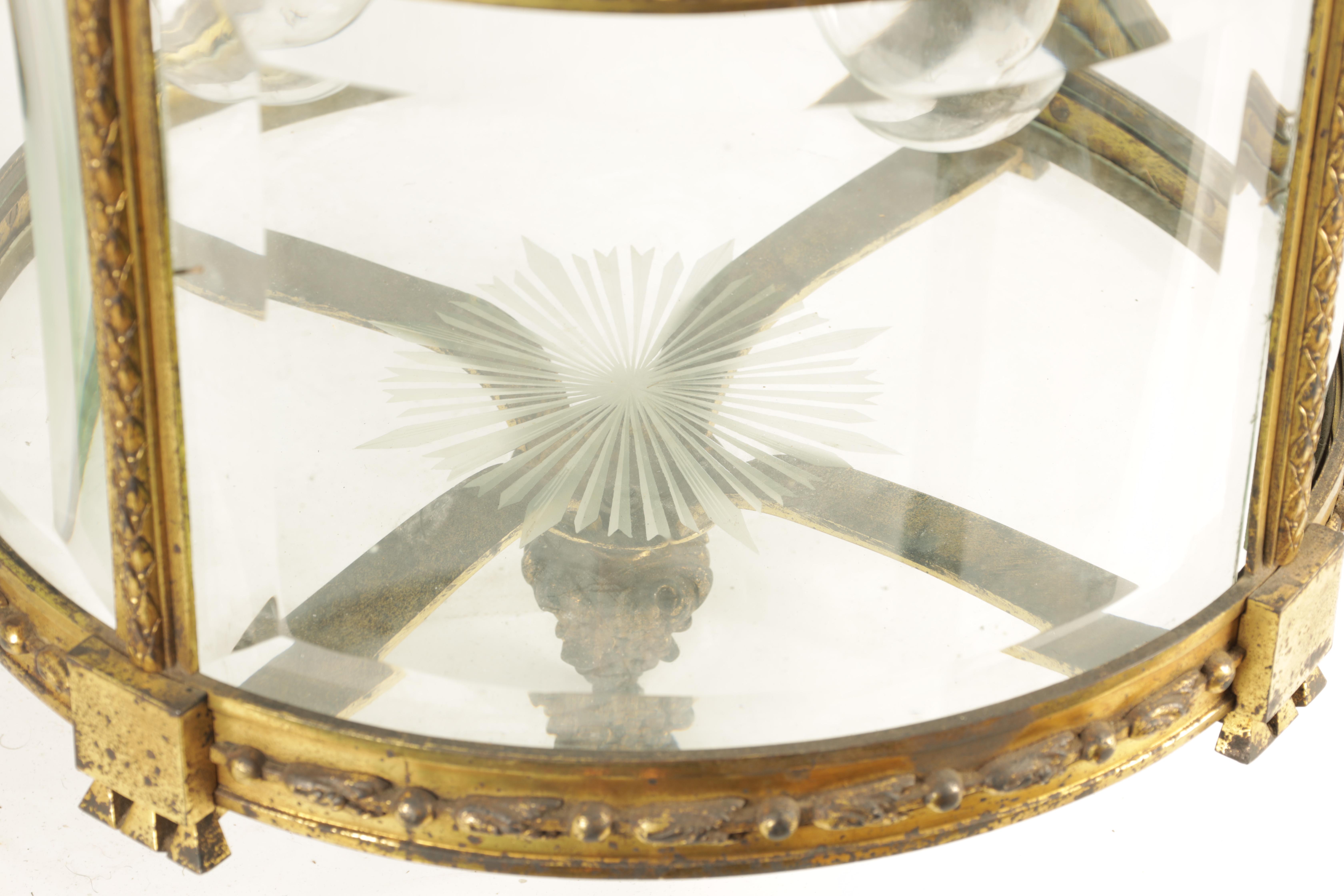 A LARGE REGENCY GILT BRASS HANGING LANTERN with leaf cast circular frame fitted with bevelled - Image 7 of 7