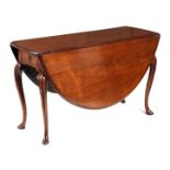 AN UNUSUAL GEORGE II FIGURED MAHOGANY DROP LEAF DINING TABLE the oval moulded-edge top having hinged