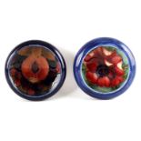 TWO MOORCROFT SHALLOW SMALL DISHES WITH CURVED RIMS decorated in the Pomegranate and Anemone pattern