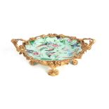 A LATE 19TH CENTURY ORMOLU MOUNTED FAMILLE ROSE CELADON DISH the floral gilt bronze border with leaf