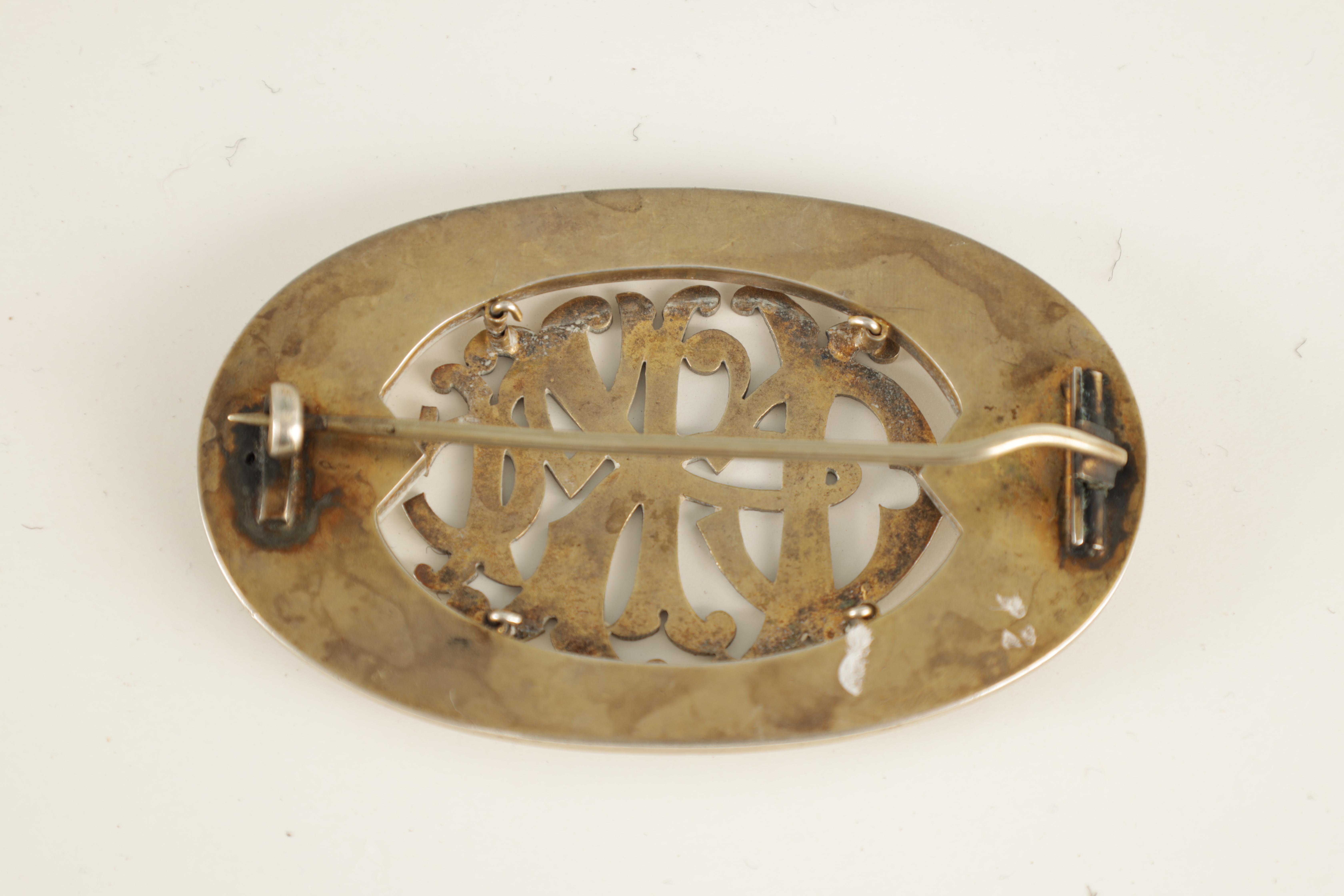 A 19TH CENTURY OVAL SILVER SCOTTISH BROOCH with Celtic design border and entwined initials to the - Image 2 of 3