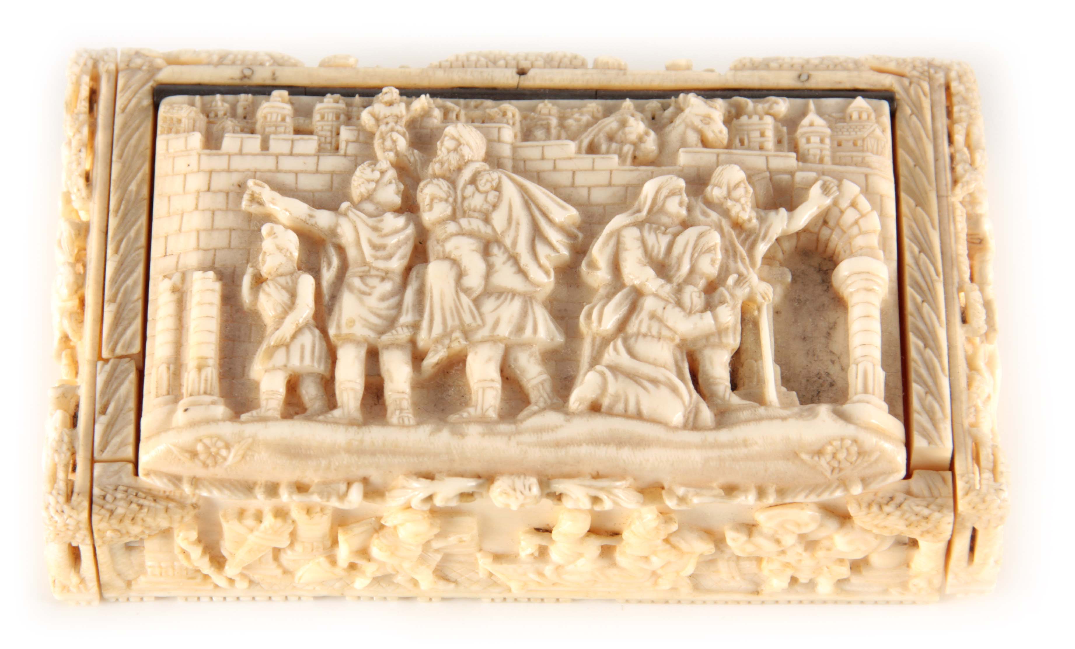 A 19TH CENTURY CONTINENTAL CARVED IVORY SNUFF BOX finely carved with mythological scenes, interior