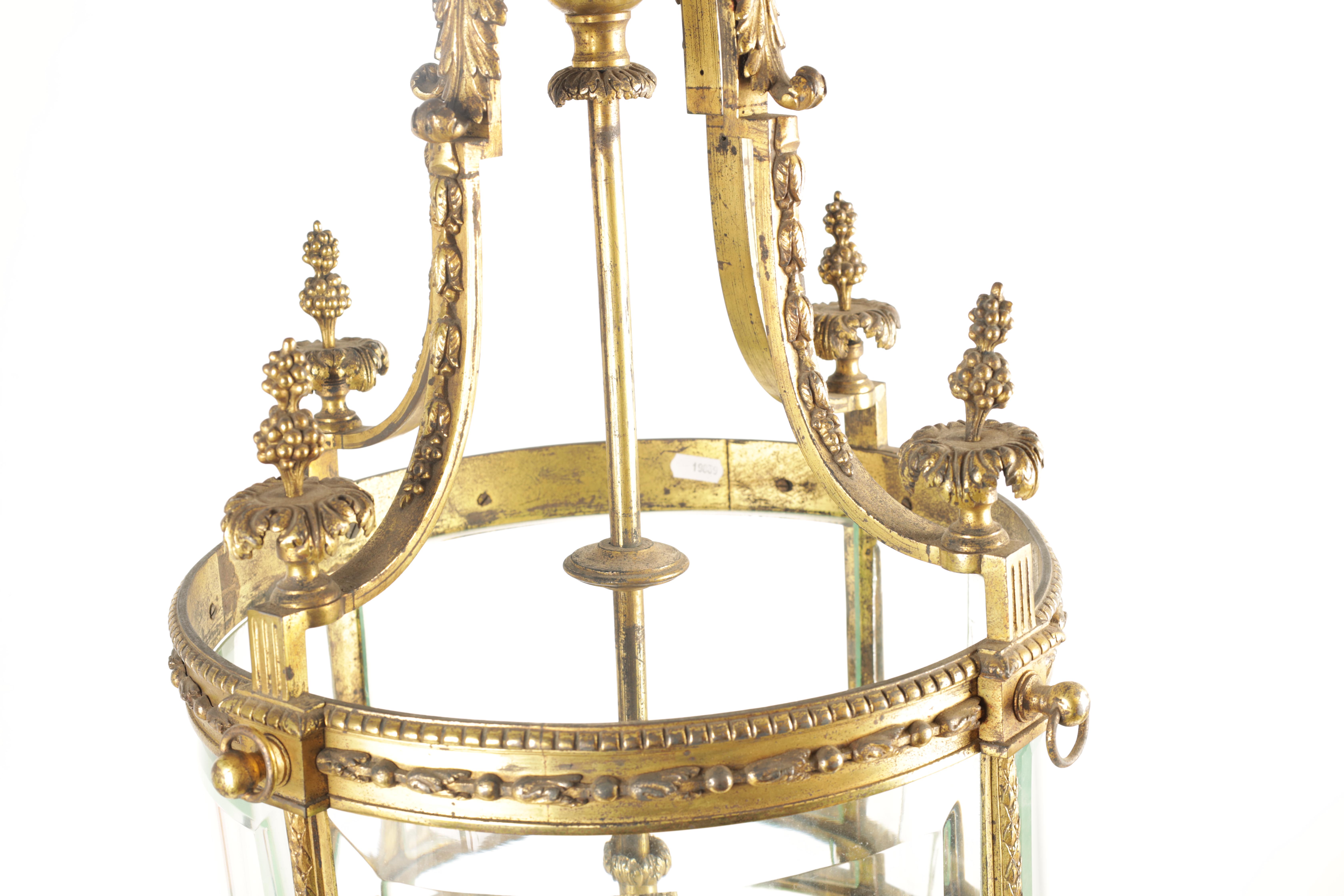 A LARGE REGENCY GILT BRASS HANGING LANTERN with leaf cast circular frame fitted with bevelled - Image 5 of 7