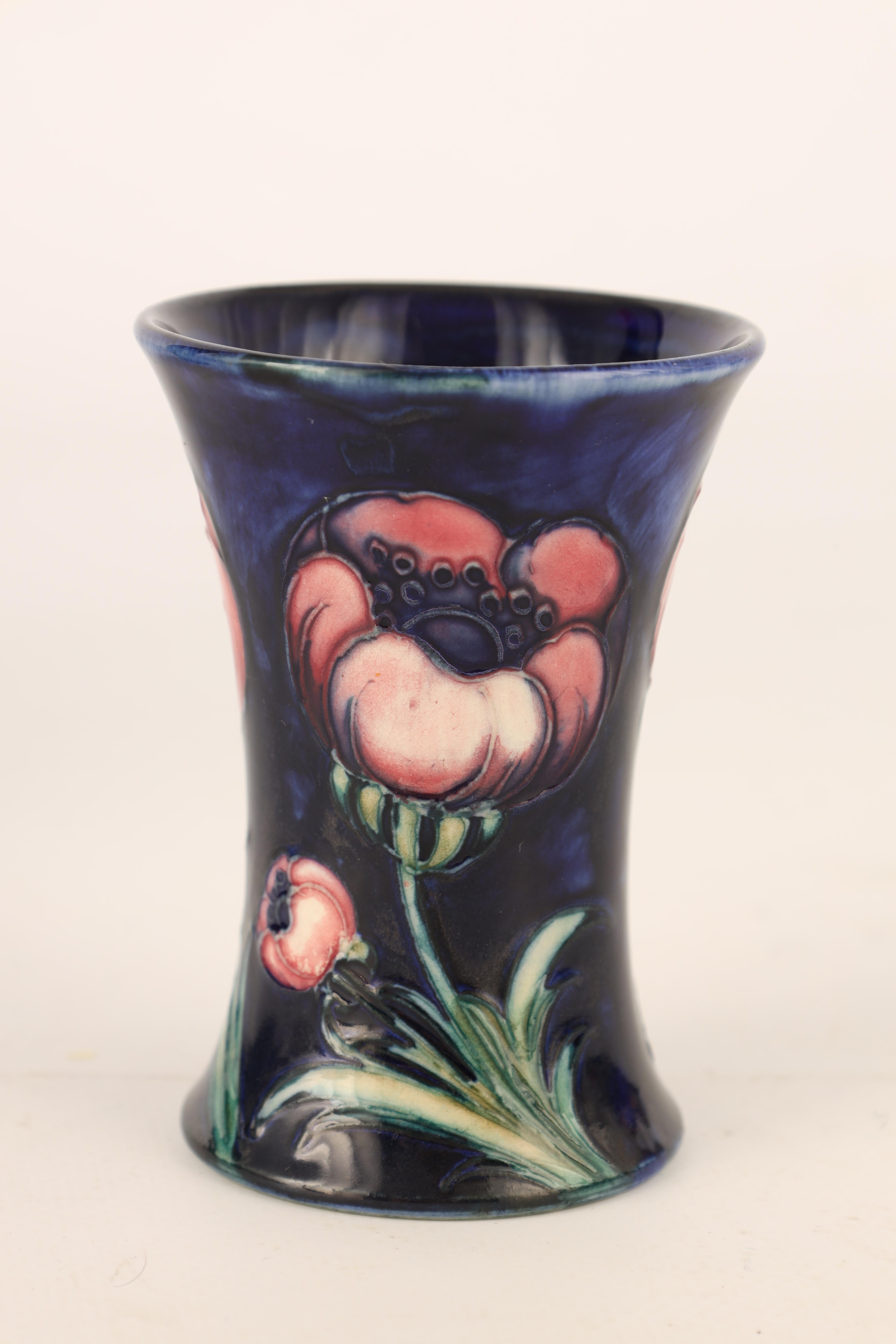 A 1920S MOORCROFT FLARED MINIATURE VASE tube lined and decorated in the Poppy pattern on a mottled - Image 3 of 4