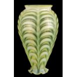 AN EARLY 20TH CENTURY VASELINE GLASS HANGING SHADE of rippled arched design, tapering body and