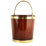 A GEORGE III BRASS BOUND MAHOGANY PEAT BUCKET with folding handle 35cm diameter 36cm high