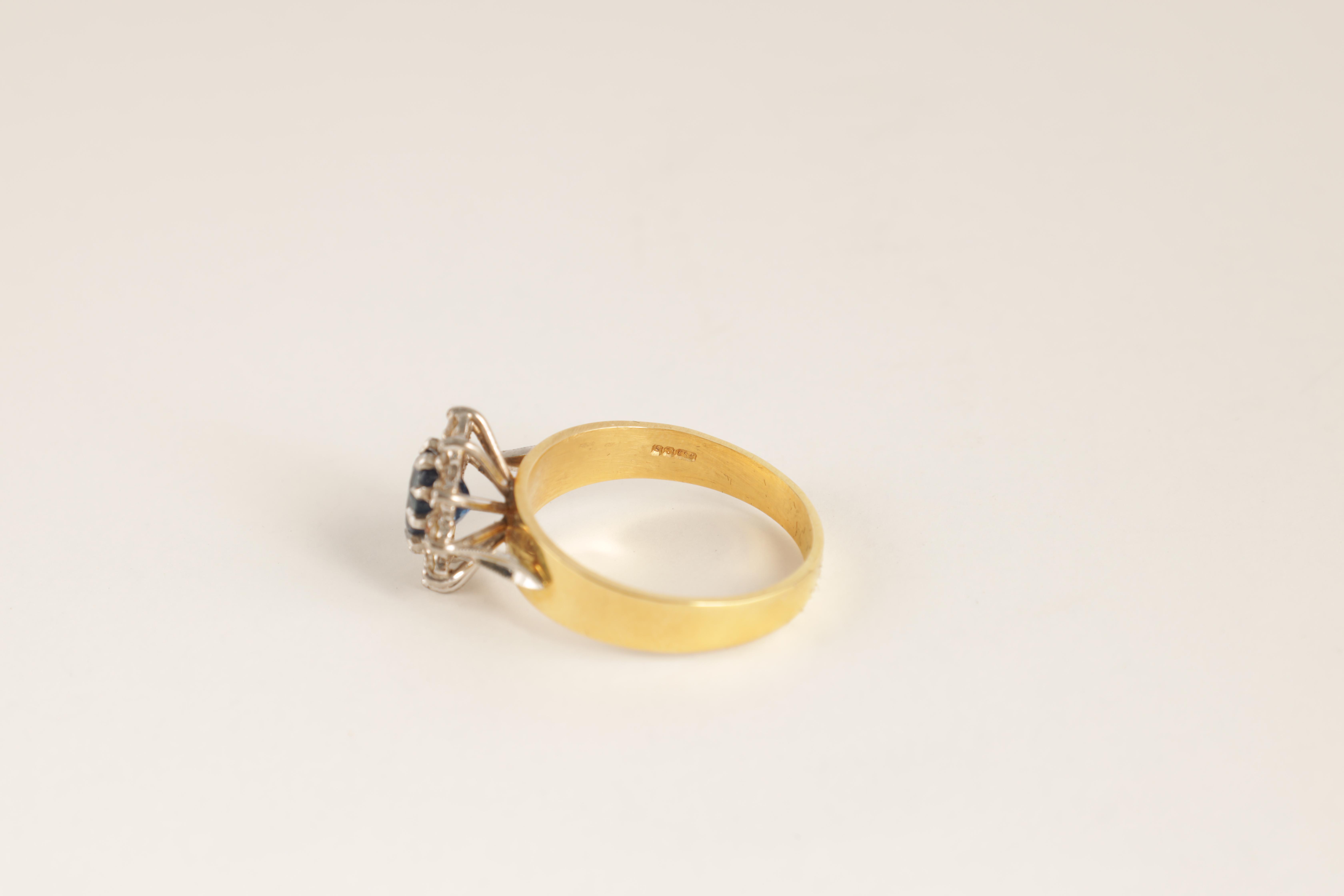 A LADIES 14CT GOLD DIAMOND AND SAPPHIRE RING with oval cut centre stone enclosed by 10 brilliant-cut - Image 5 of 6