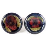 TWO MOORCROFT SHALLOW SMALL DISHES WITH CURVED RIMS both decorated in the Big Pansy pattern on