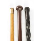 AN 18TH CENTURY EBONY BARLEY TWIST WALKING STICK 89cm overall TOGETHER WITH A 19TH CENTURY AFRICAN