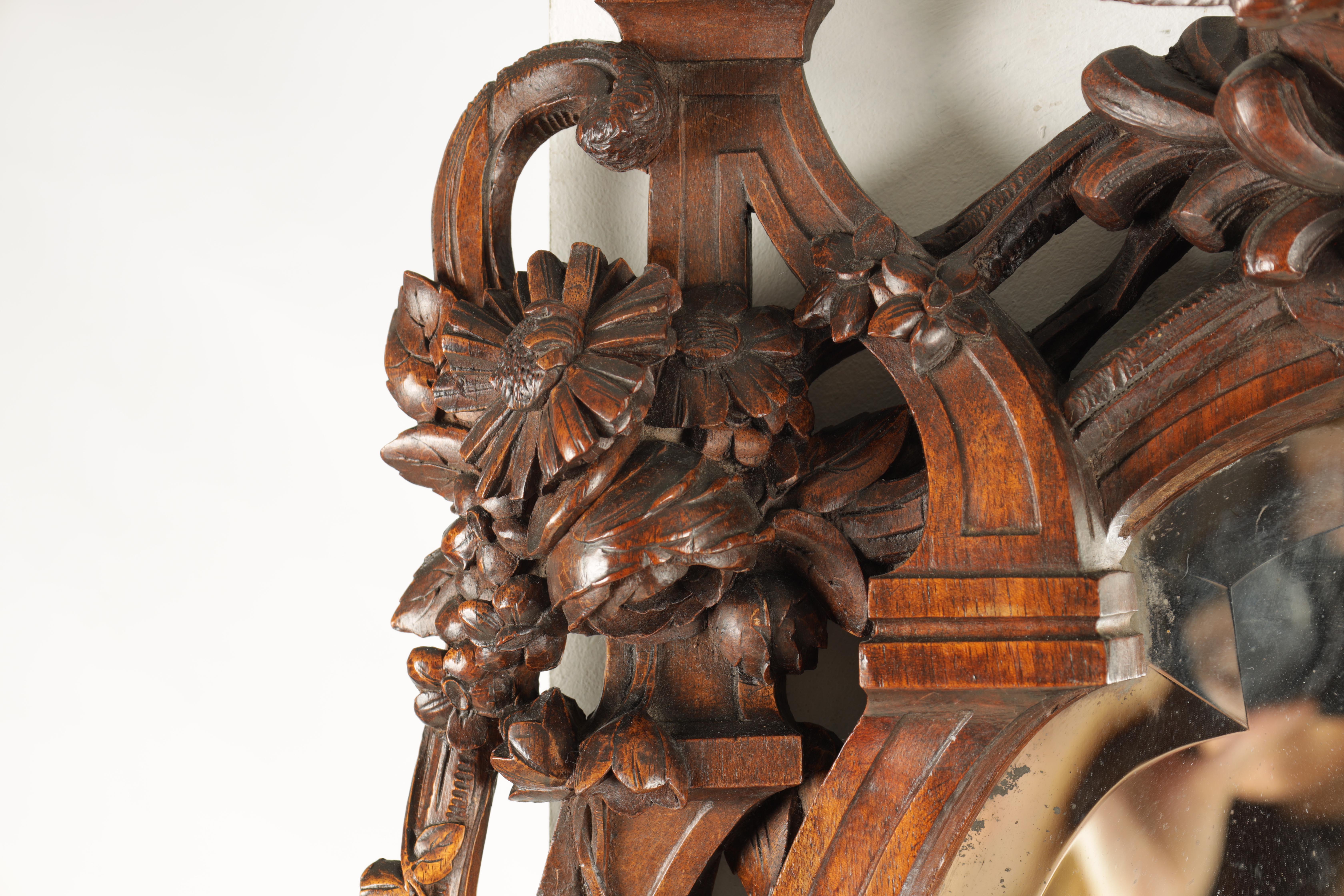 A 19TH CENTURY WALNUT BLACK FOREST CARVED HANGING MIRROR with a pair of doves to the top and a - Image 4 of 5