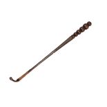 A LATE 19TH CENTURY INDIAN CARVED HARDWOOD RIDING CROP with tapered bobbin carved handle with spiral