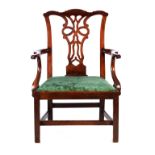 AN 18TH CENTURY CHIPPENDALE STYLE MAHOGANY OPEN ARMCHAIR with pierced shaped back splat and scrolled