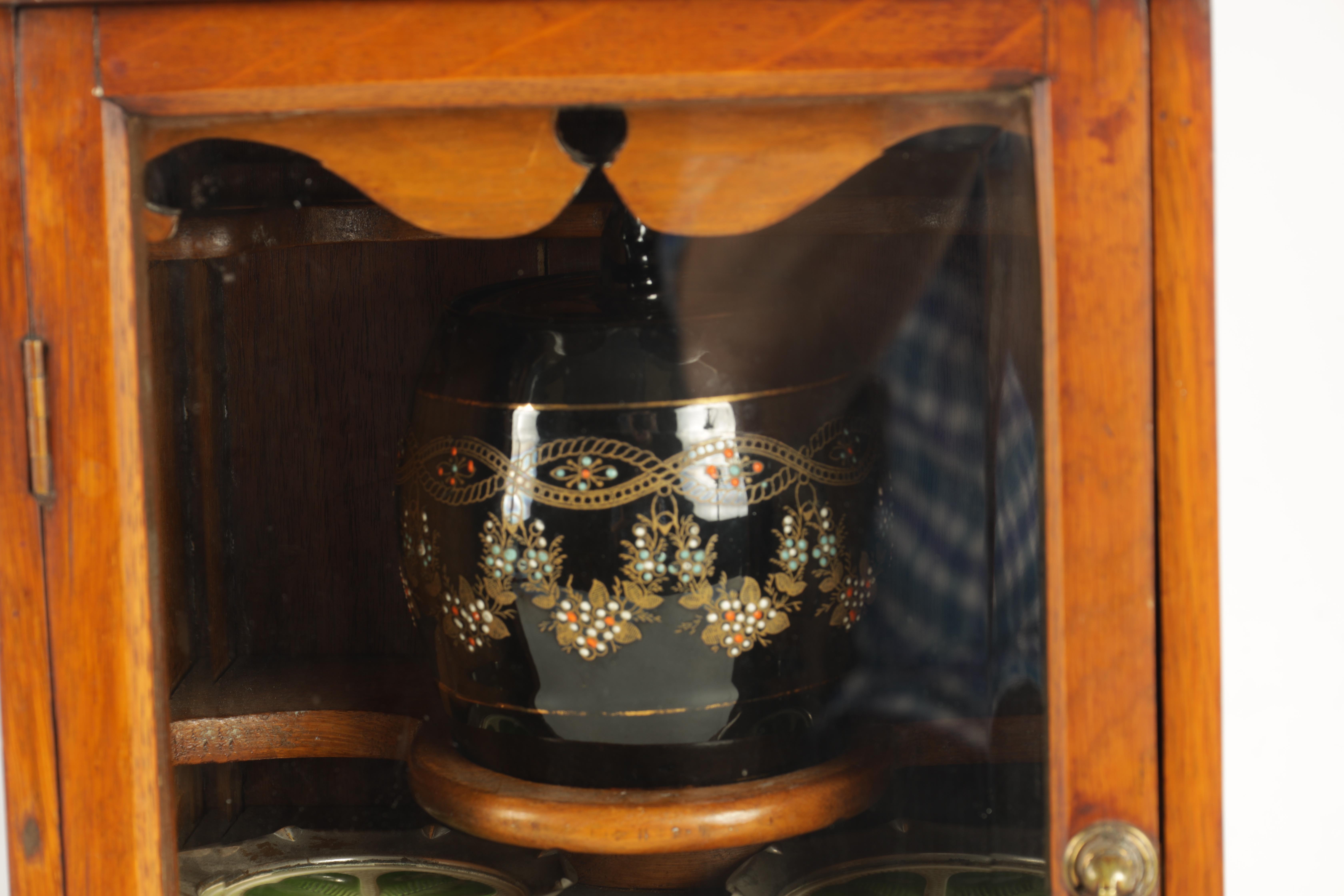 A STYLISH EDWARDIAN OAK SMOKERS CABINET with glazed door enclosing a shelved three drawer interior - Image 2 of 11