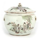 AN 18TH CENTURY CHINESE PORCELAIN FOOD JAR AND COVER decorated with figures in a tree lined
